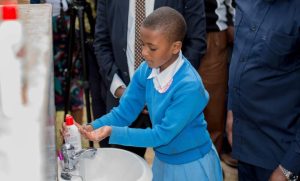 a-student-from-mringa-primary-school-washing-her-hands-in-a-new-handwashing-facility-780x470